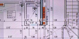 Ein detaillierter Grundriss zeigt die Anordnung von Räumen, einschließlich einer Küche mit 8,40 m² Fläche.